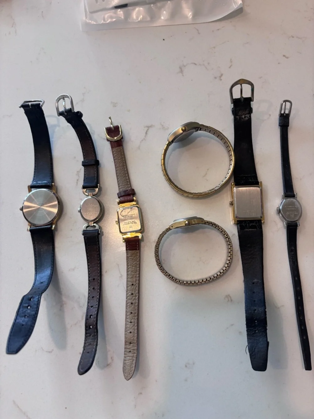 7 vintage watches.  As-is